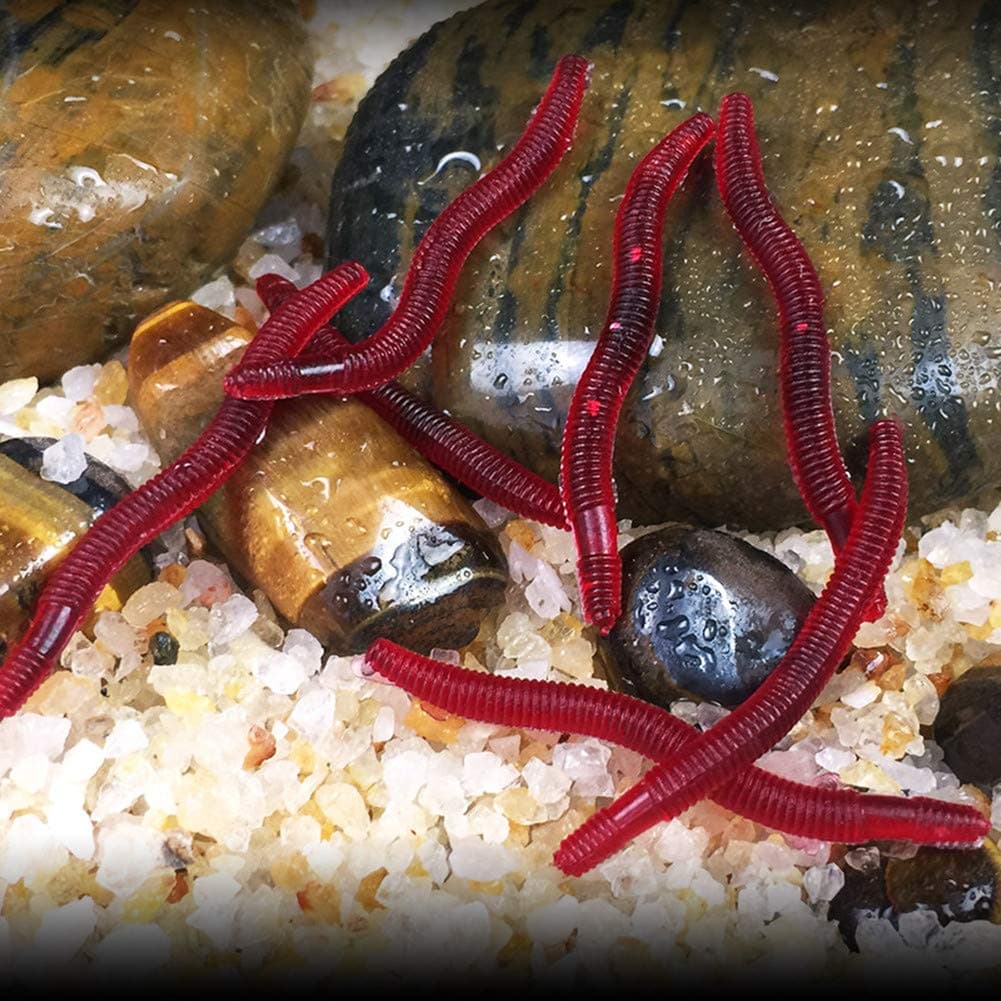 Transparenter falscher bionischer K?der, der mit h?ngender Garnele h?ngt